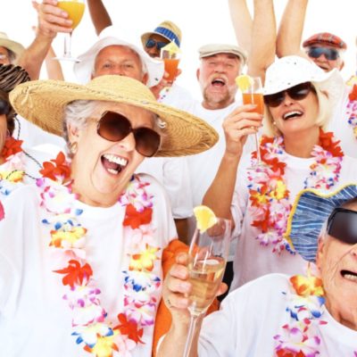quem-somos-asconprev2 Senior citizens partying the Hawaiian style over white background